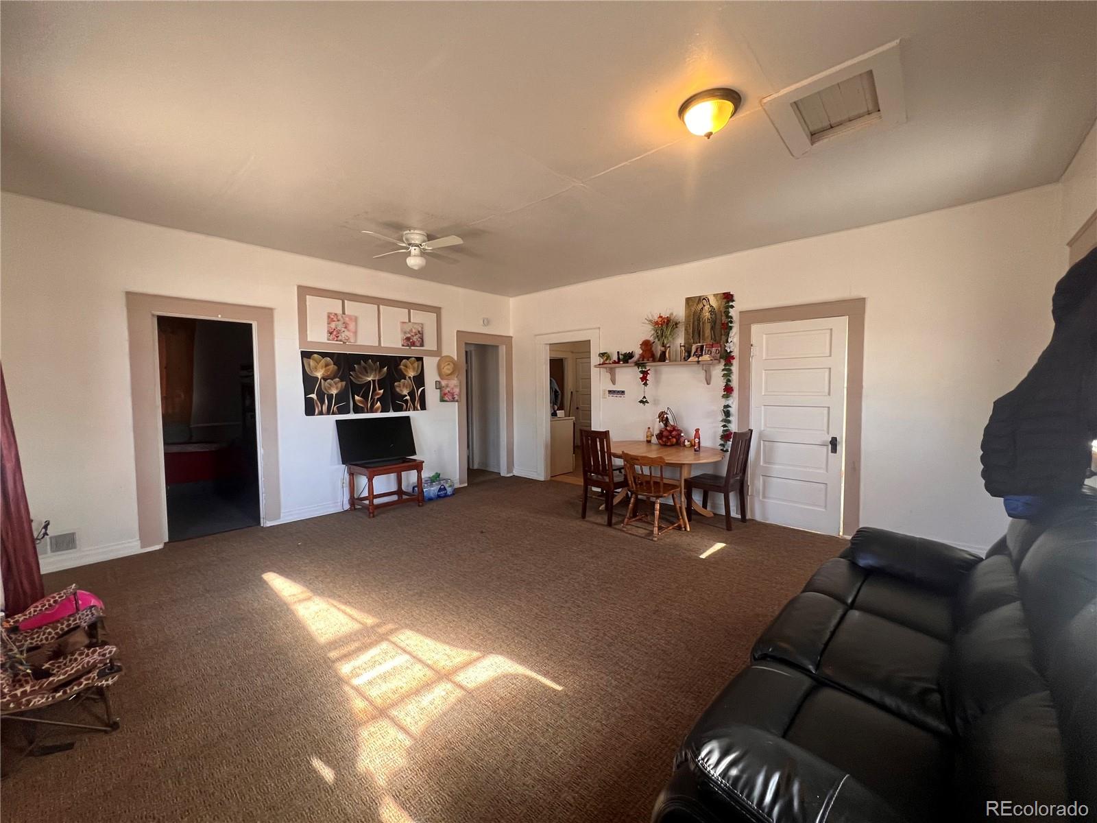 38563 Monroe Street Agate, CO 80101 - Photo 27 of 28 a view of a livingroom with furniture and a flat screen tv