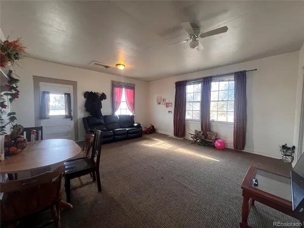 a room with furniture and tables in it