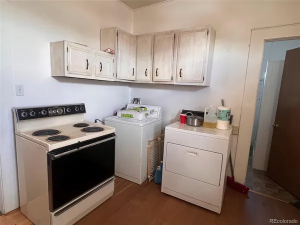 a view of cabinets with washer and dryer