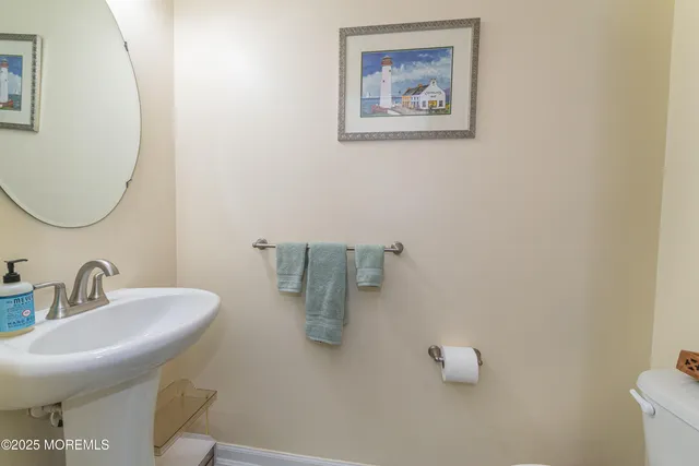 a bathroom with a sink and mirror