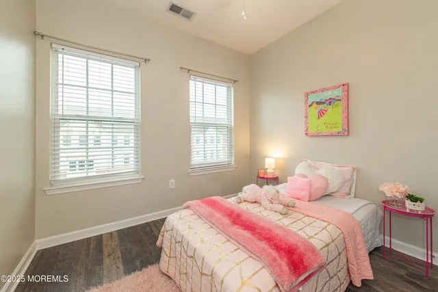 a bathroom with a sink a toilet and shower curtain