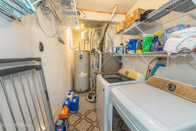 a porch with a table and chairs and potted plants