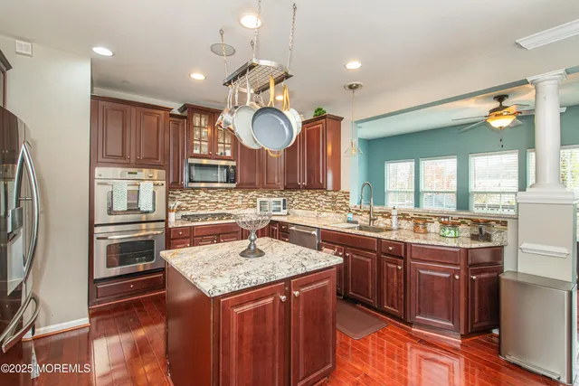 a kitchen with a sink stove and cabinets