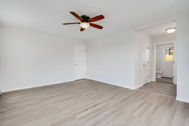 a spacious bathroom with a double vanity sink and a mirror