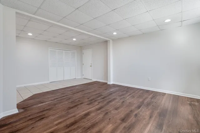 a kitchen with granite countertop a refrigerator stove and oven