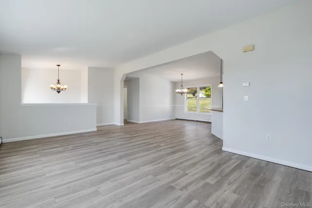 a view of a kitchen with wooden floor