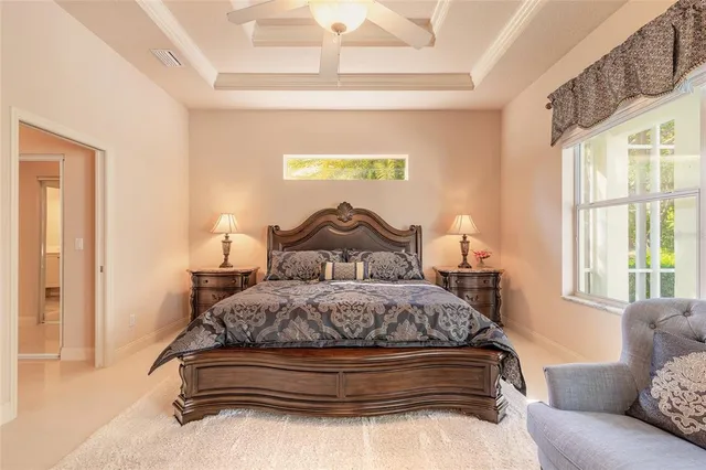 a bedroom with a bed and window