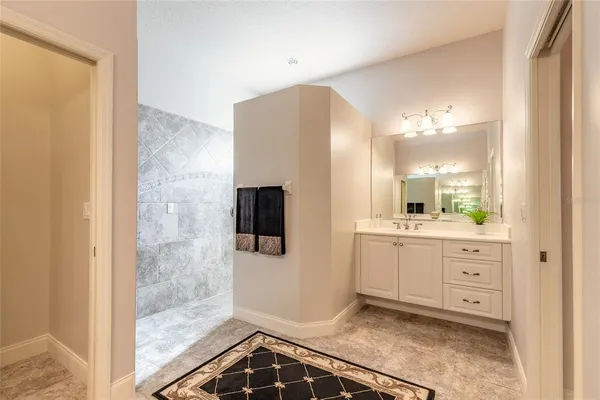 a bathroom with a shower and a tub