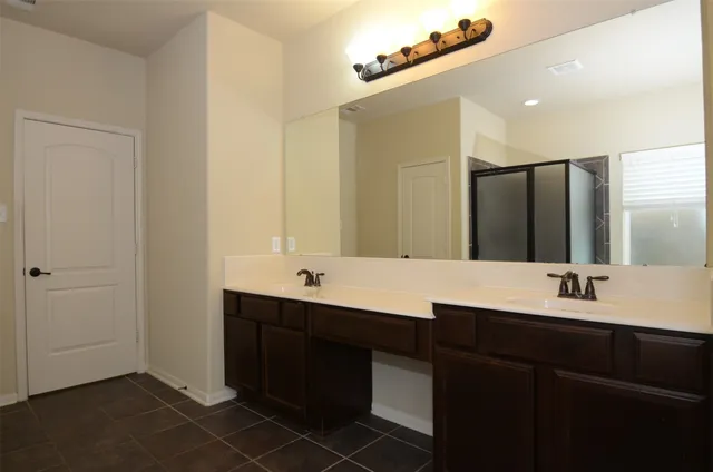 a view of an empty room and a window