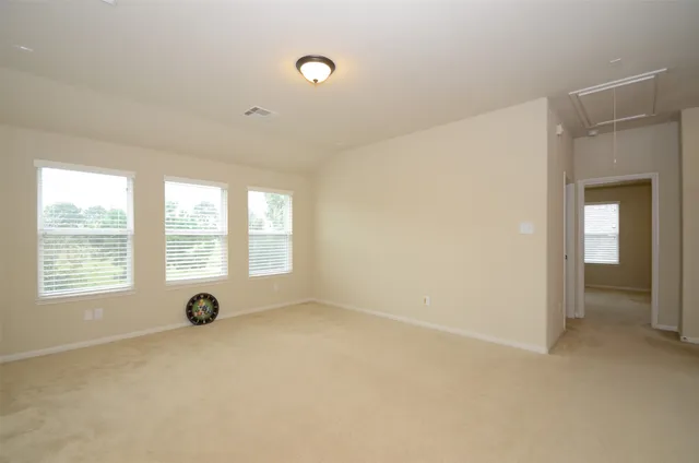 an empty room with a empty space and a window