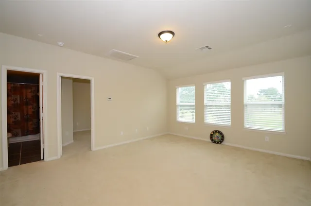 a view of an empty room and window