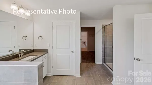 a room that has a sink and a mirror