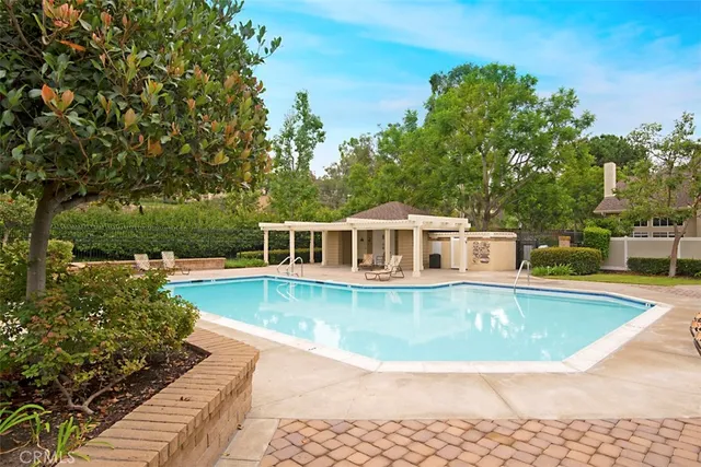 a view of a swimming pool with lounge chair