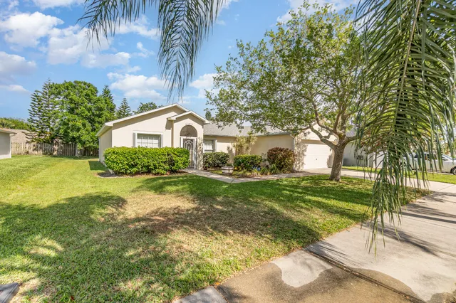 a house view with a garden space