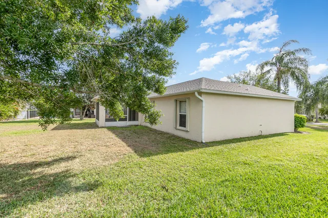 a house with swimming pool in front of it