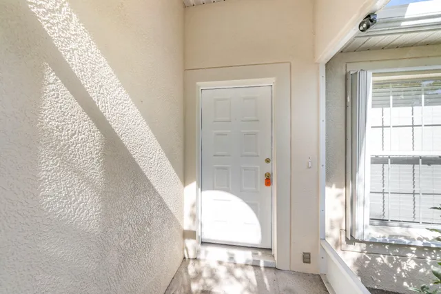 a view of a living room with windows