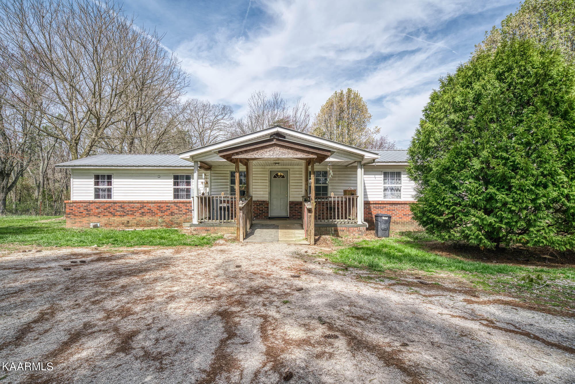 2371 Roslin Road Jamestown, TN 38556 - Photo 1 of 38 a view of a house with a yard and large tree