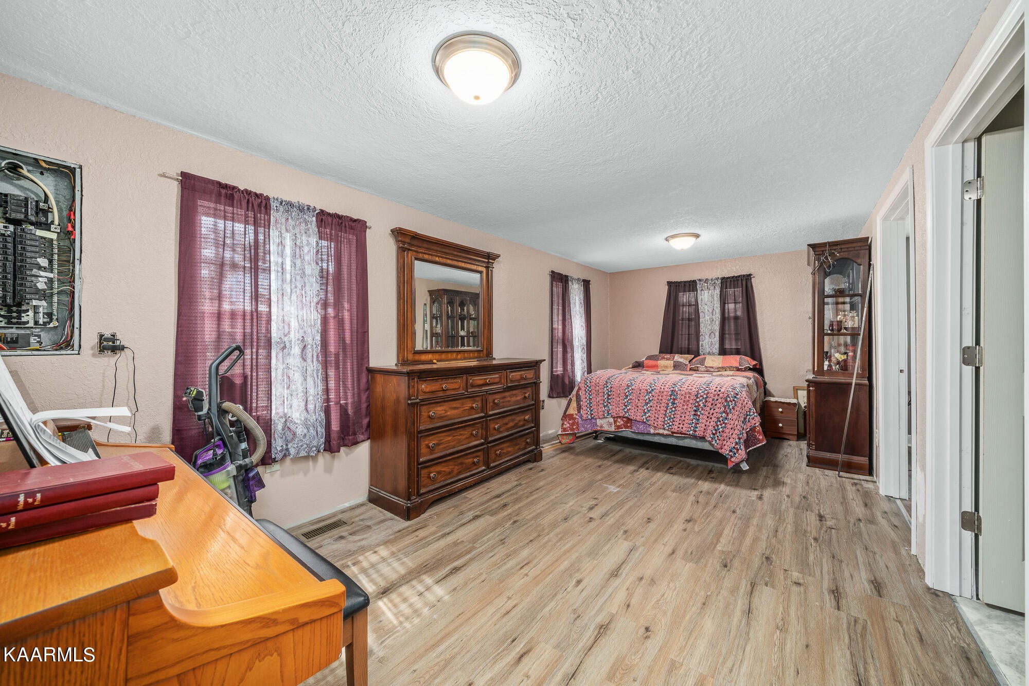 2371 Roslin Road Jamestown, TN 38556 - Photo 13 of 38 a bedroom with a bed and wooden floor