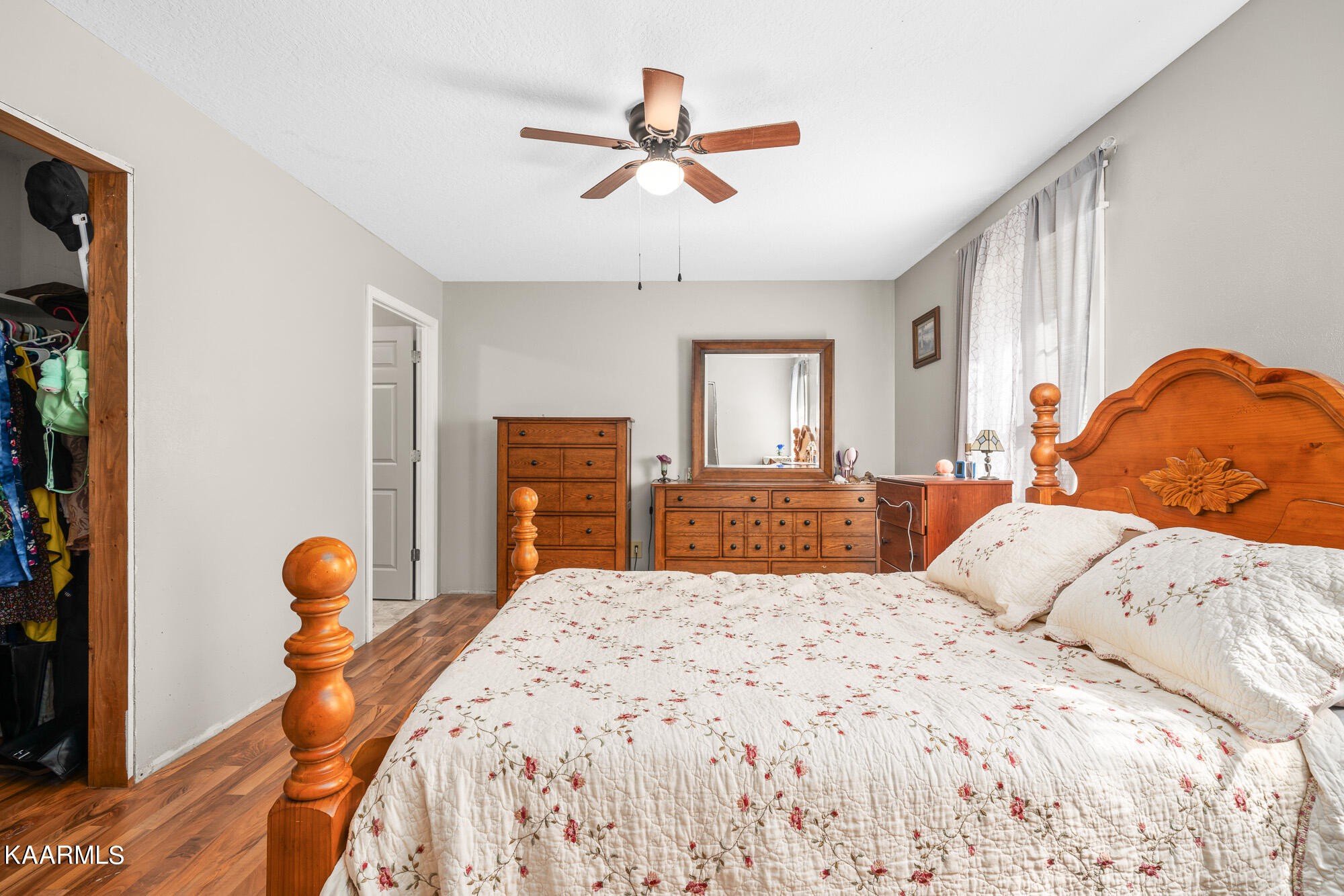 2371 Roslin Road Jamestown, TN 38556 - Photo 23 of 38 a bedroom with a bed and a chandelier