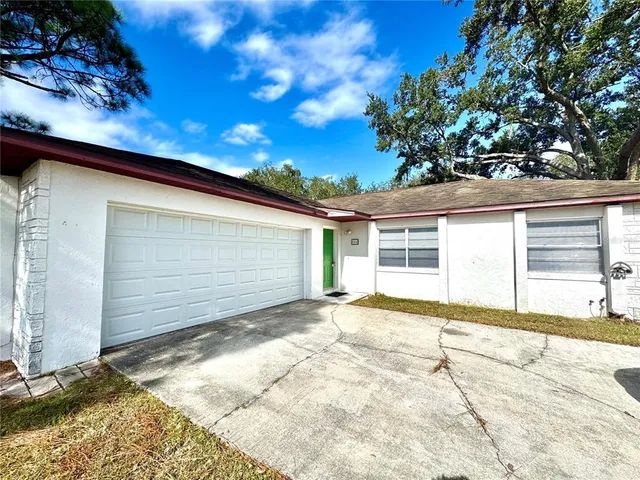 a view of backyard of a house