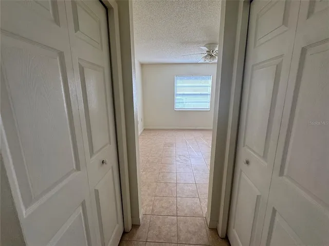 a view of bathroom with a sink and mirror