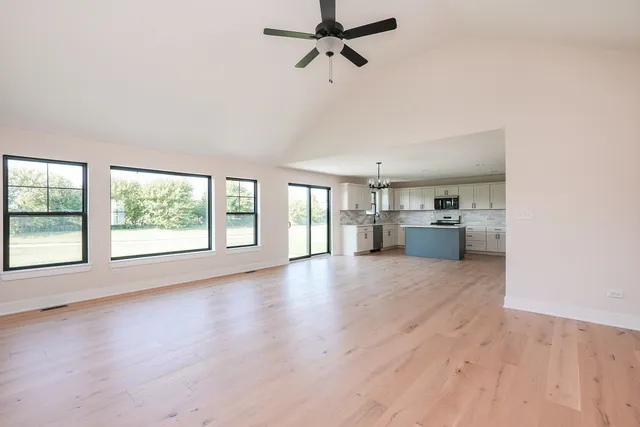 a view of a kitchen with a sink and cabinets