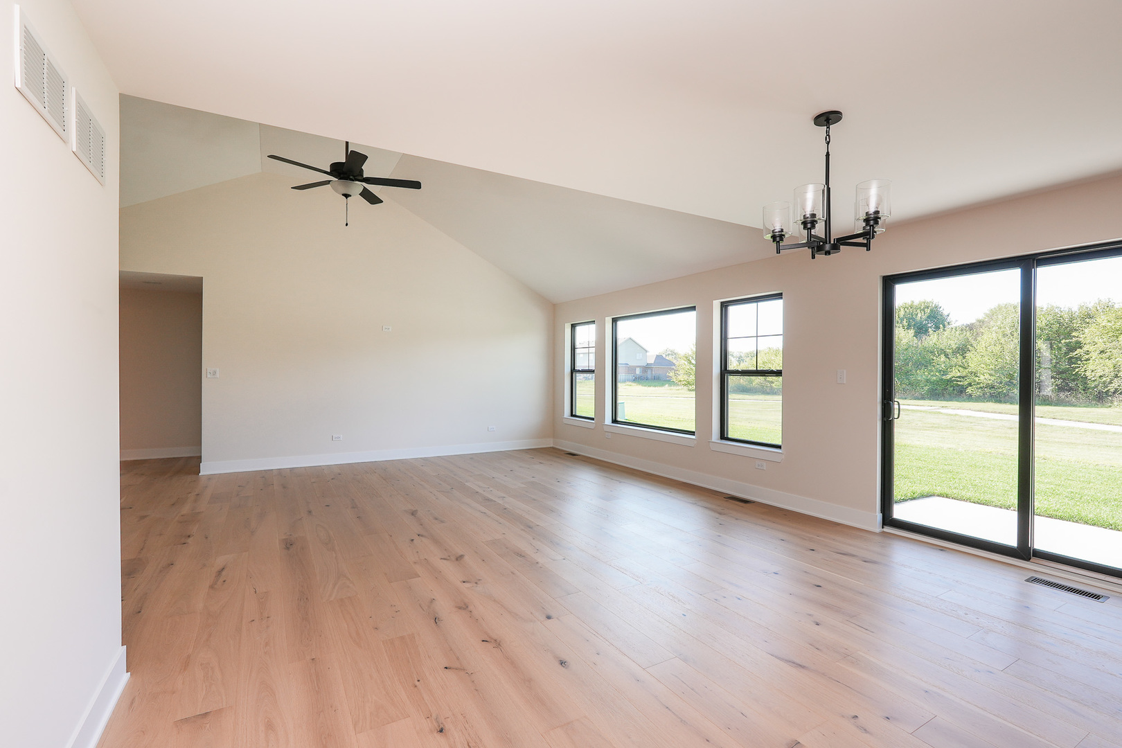 985 Spring Street Manteno, IL 60950 - Photo 17 of 46 a view of room with wooden floor fan and window