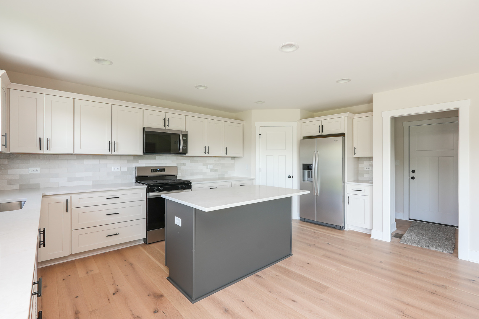 985 Spring Street Manteno, IL 60950 - Photo 20 of 46 a kitchen with stainless steel appliances a sink a stove a refrigerator and cabinets