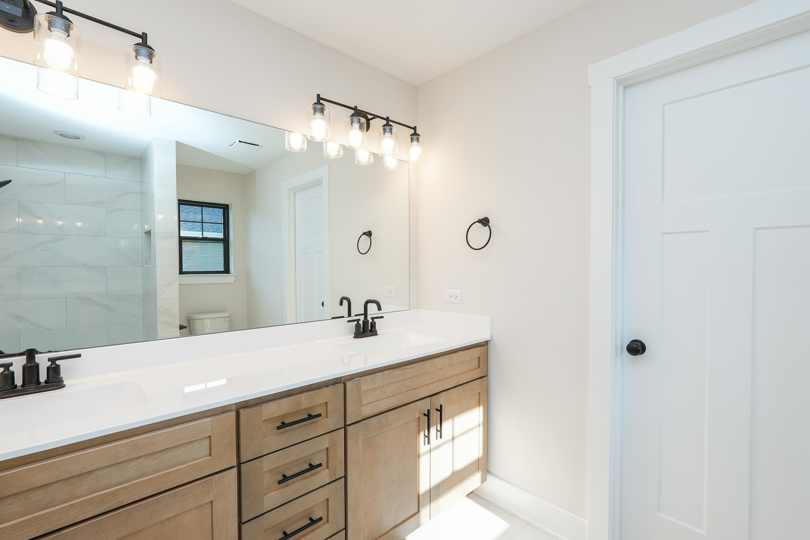 985 Spring Street Manteno, IL 60950 - Photo 27 of 46 a bathroom with a sink and a mirror