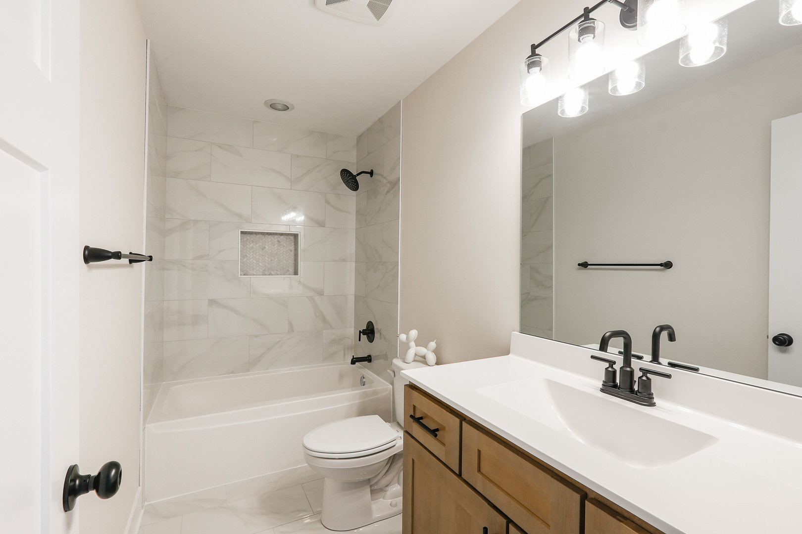 985 Spring Street Manteno, IL 60950 - Photo 30 of 46 a bathroom with a sink a toilet and shower