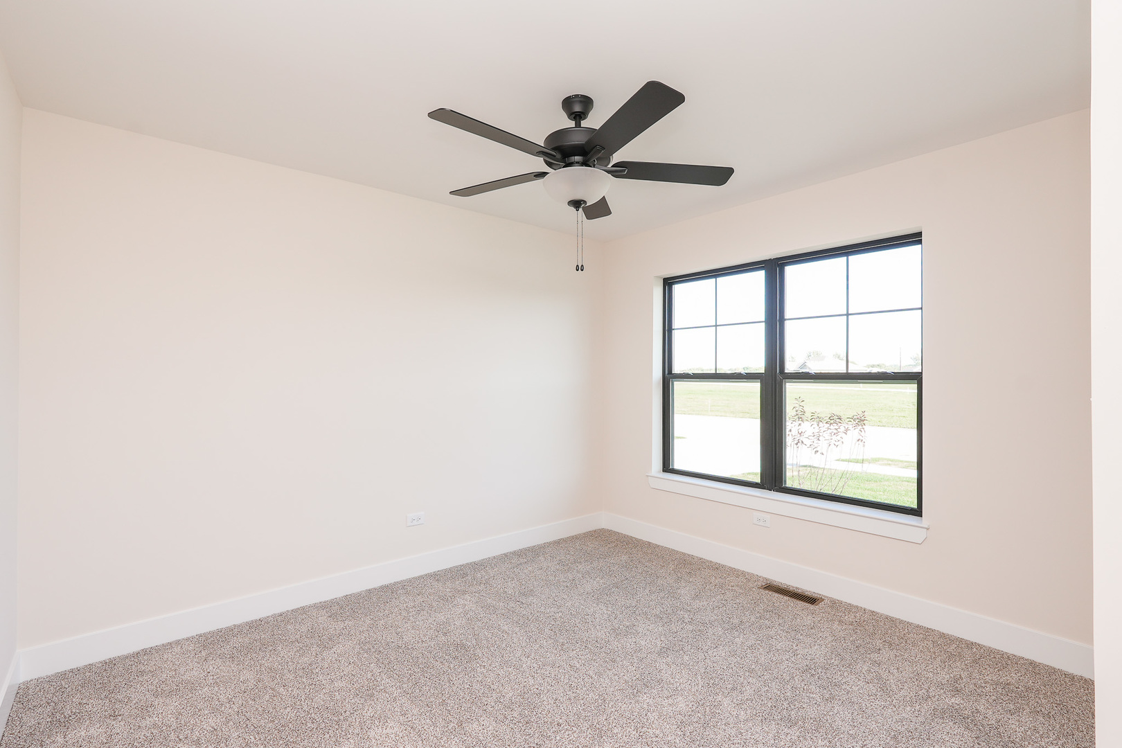 985 Spring Street Manteno, IL 60950 - Photo 33 of 46 an empty room with windows and fan
