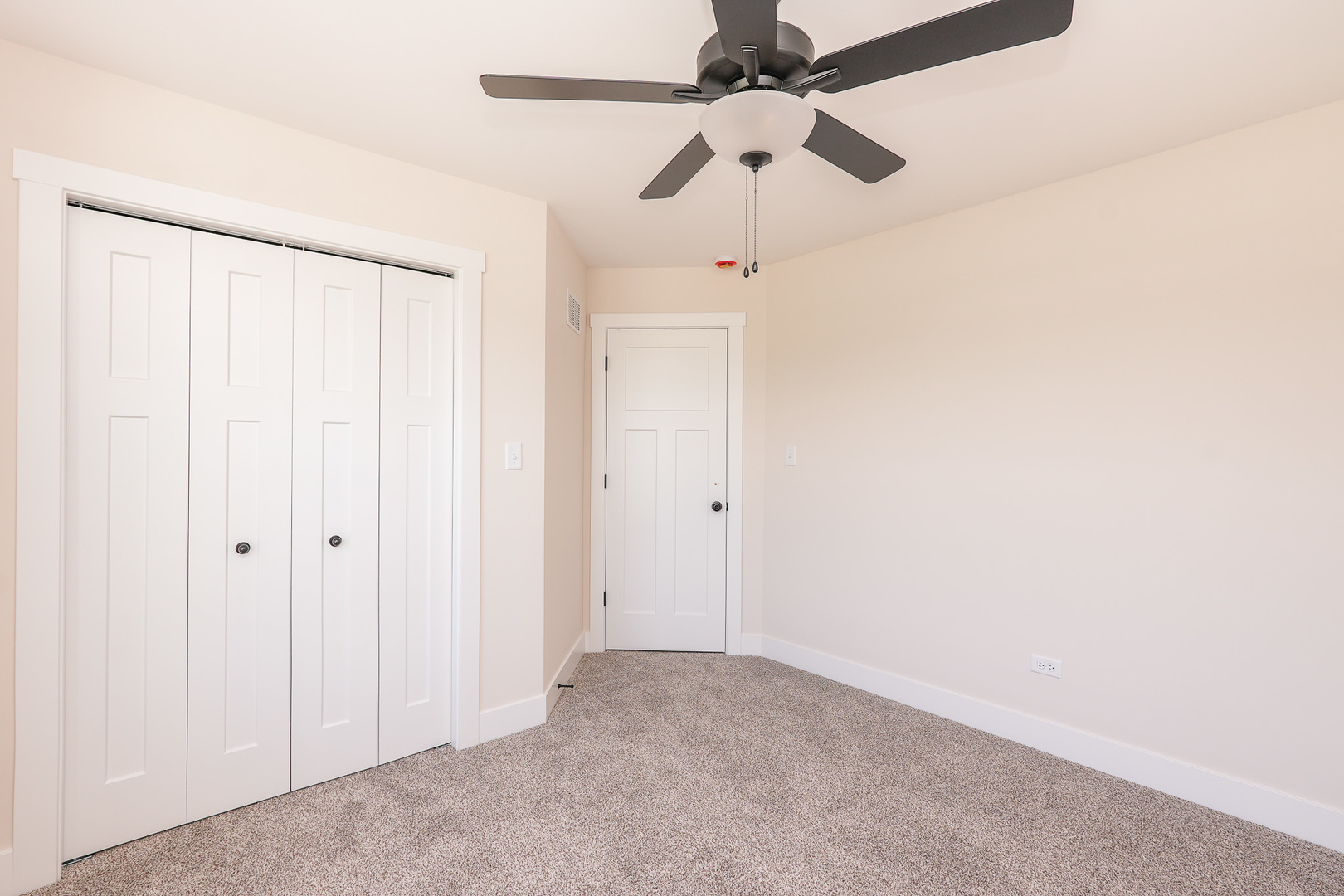 985 Spring Street Manteno, IL 60950 - Photo 38 of 46 an empty room with a ceiling fan and a window