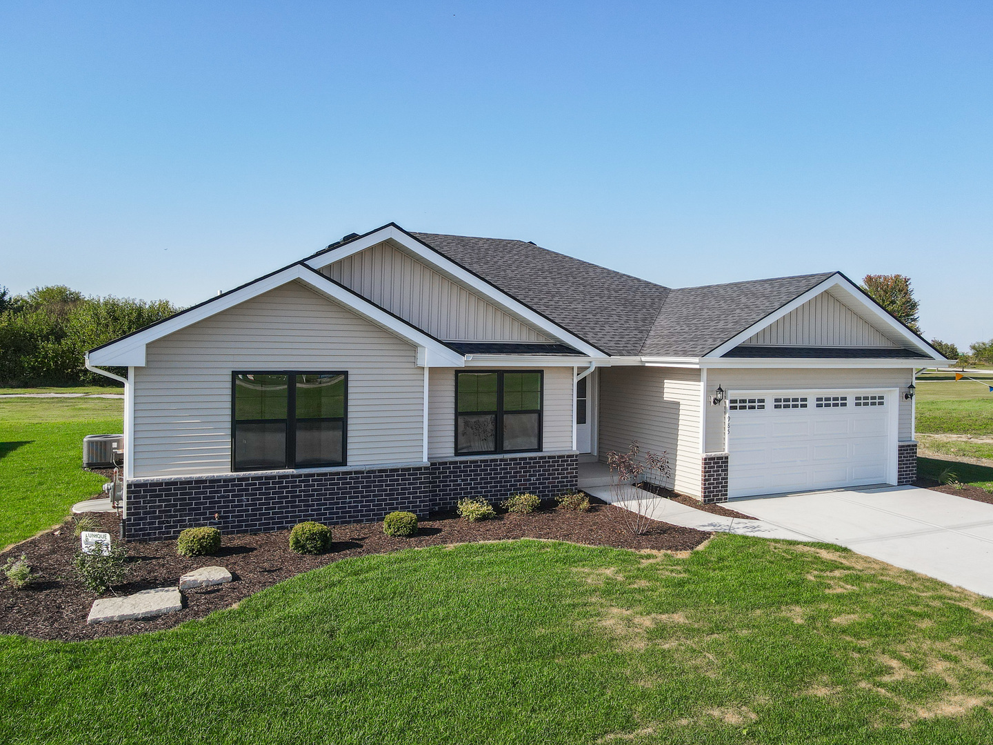 985 Spring Street Manteno, IL 60950 - Photo 4 of 46 a front view of house with yard and green space