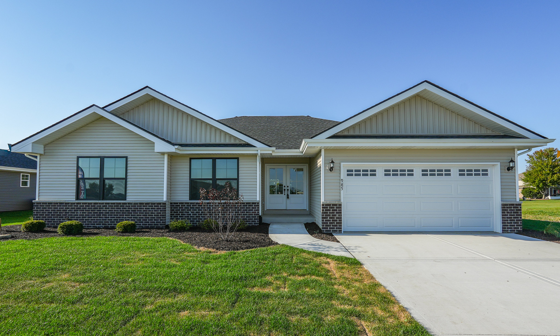 985 Spring Street Manteno, IL 60950 - Photo 43 of 46 a front view of a house with garden