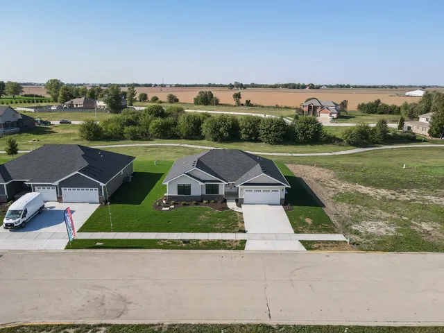 an aerial view of a house with big yard