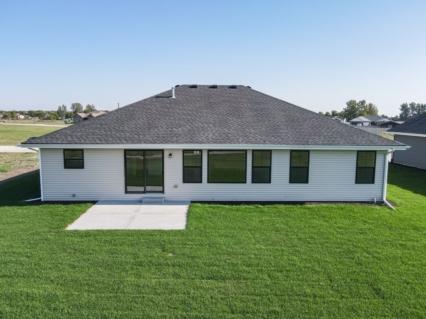 985 Spring Street Manteno, IL 60950 - Photo 9 of 46 a front view of a house with a garden