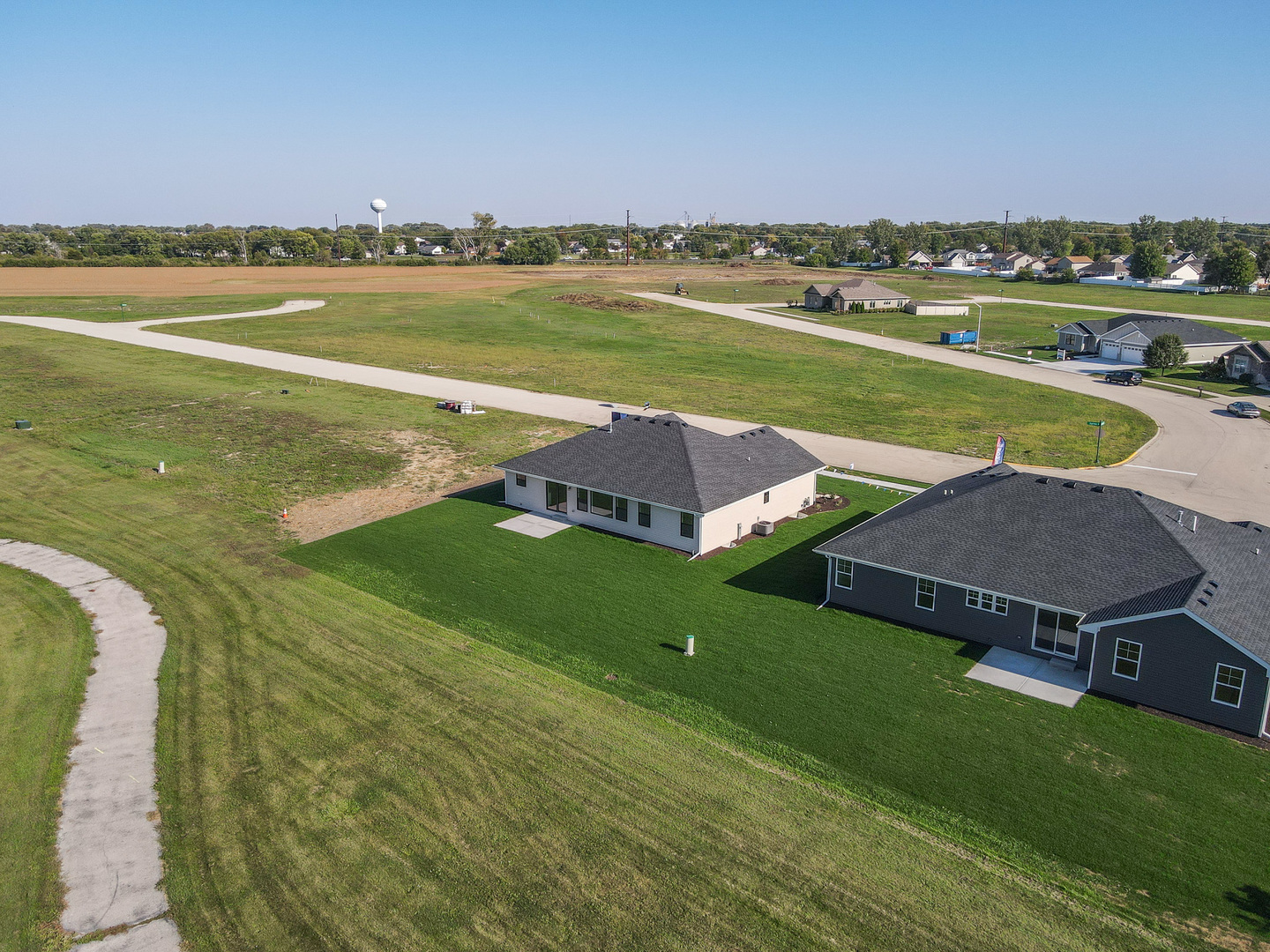 985 Spring Street Manteno, IL 60950 - Photo 10 of 46 a view of a lake with a house in the background