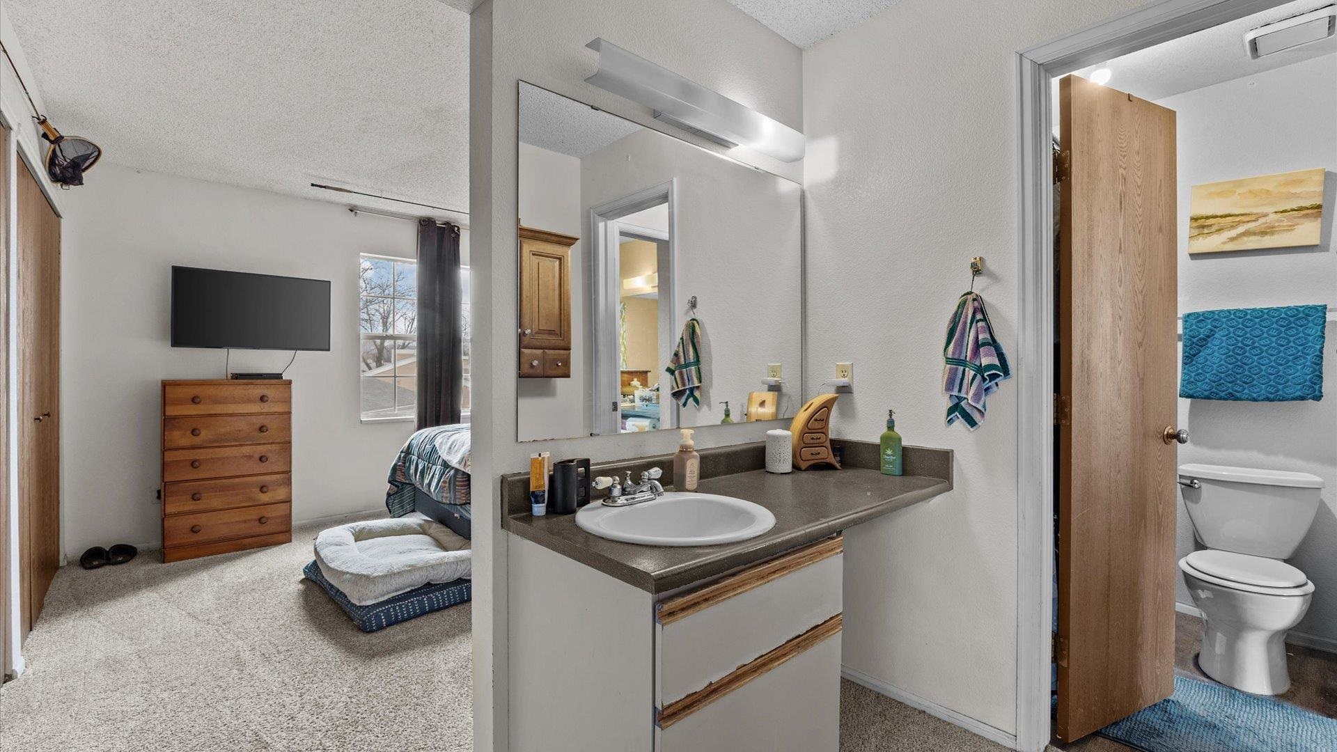 264 Coventry Court, Unit 32 Grand Junction, CO 81503 - Photo 10 of 17 a bathroom with a sink toilet and a mirror