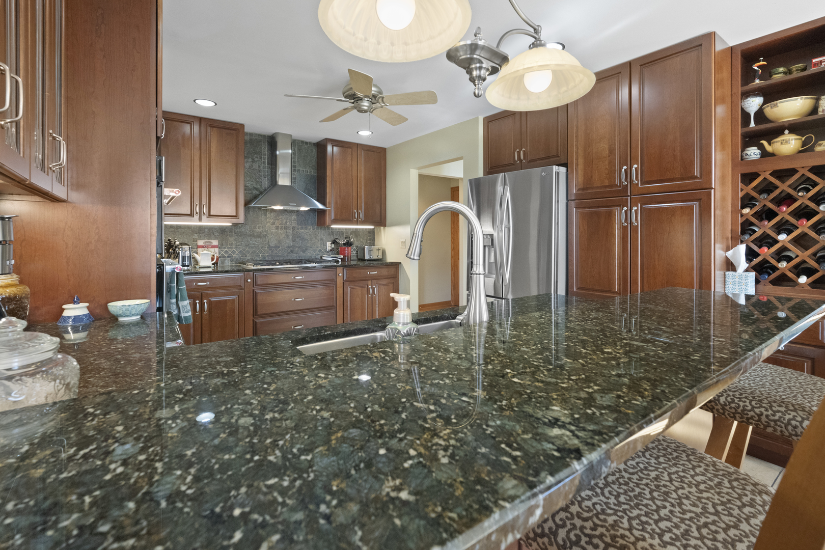 8202 Eagle Ridge Spring Grove, IL 60081 - Photo 11 of 44 a kitchen with stainless steel appliances granite countertop a stove refrigerator and cabinets