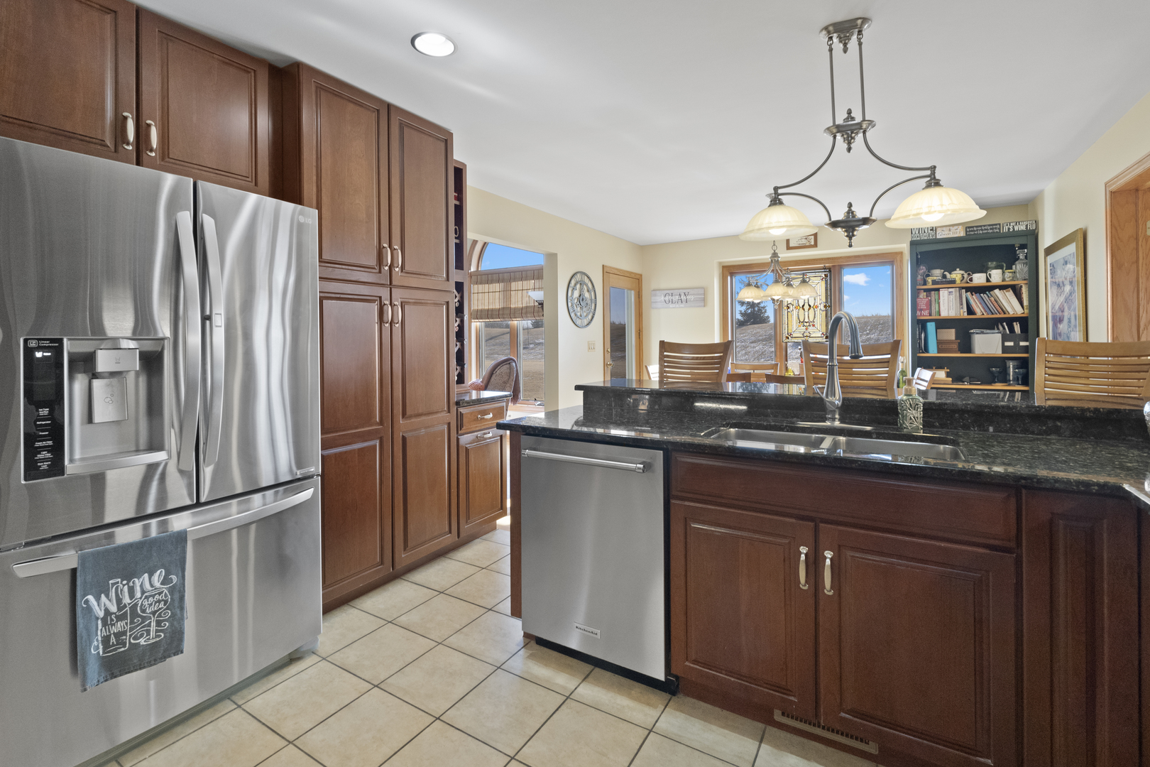 8202 Eagle Ridge Spring Grove, IL 60081 - Photo 14 of 44 a kitchen with stainless steel appliances granite countertop a refrigerator a sink and a stove