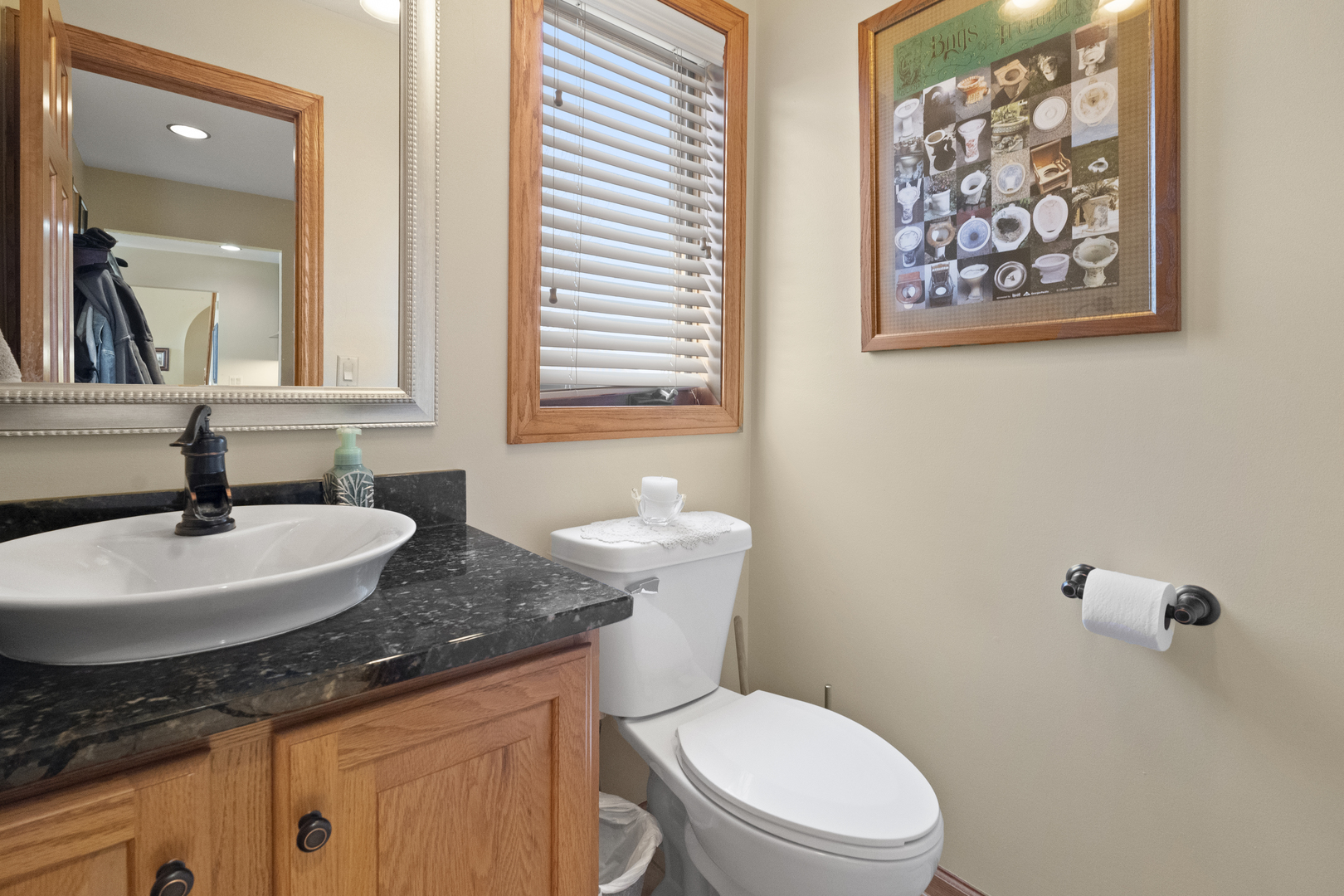 8202 Eagle Ridge Spring Grove, IL 60081 - Photo 16 of 44 a bathroom with a granite countertop sink and a toilet