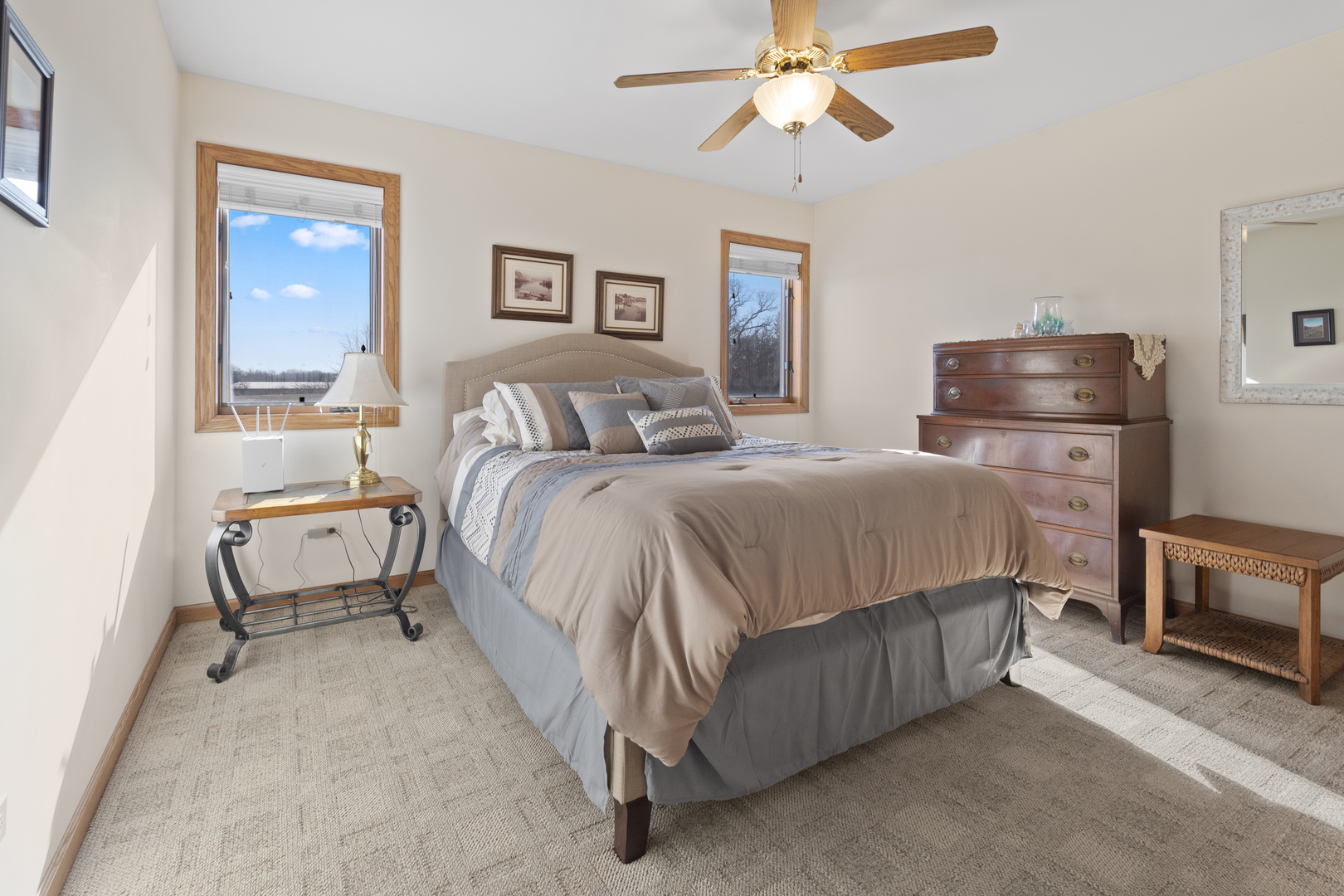 8202 Eagle Ridge Spring Grove, IL 60081 - Photo 28 of 44 a bedroom with a bed and a chandelier