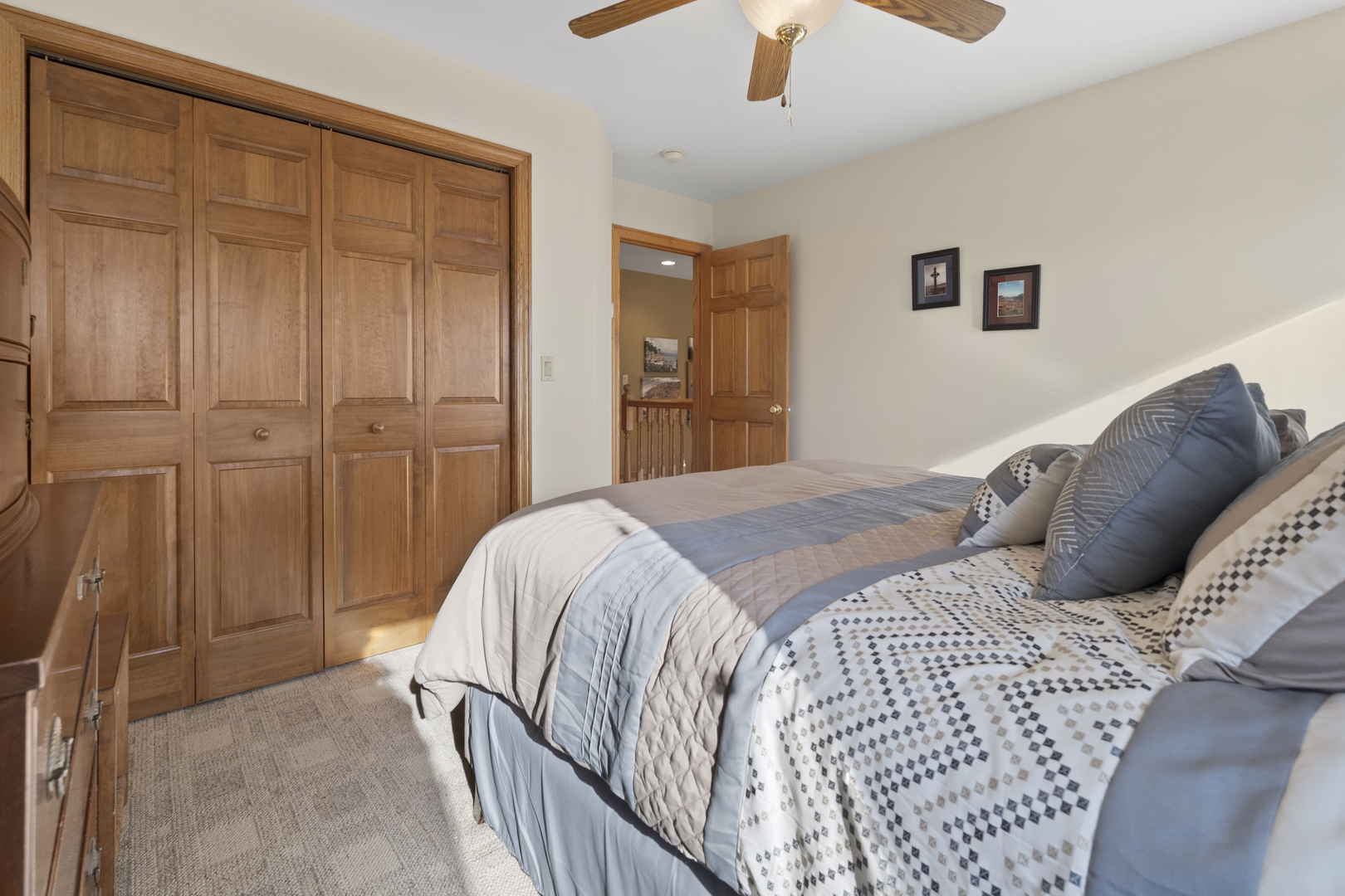 8202 Eagle Ridge Spring Grove, IL 60081 - Photo 29 of 44 a bedroom with a bed and a chandelier