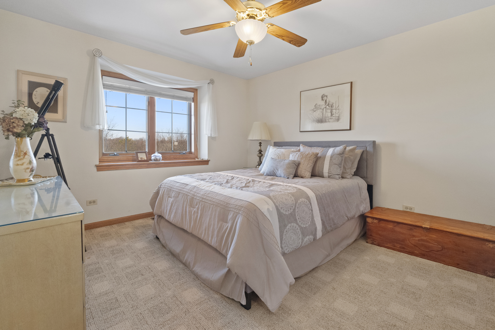 8202 Eagle Ridge Spring Grove, IL 60081 - Photo 32 of 44 a bedroom with a bed and a chandelier