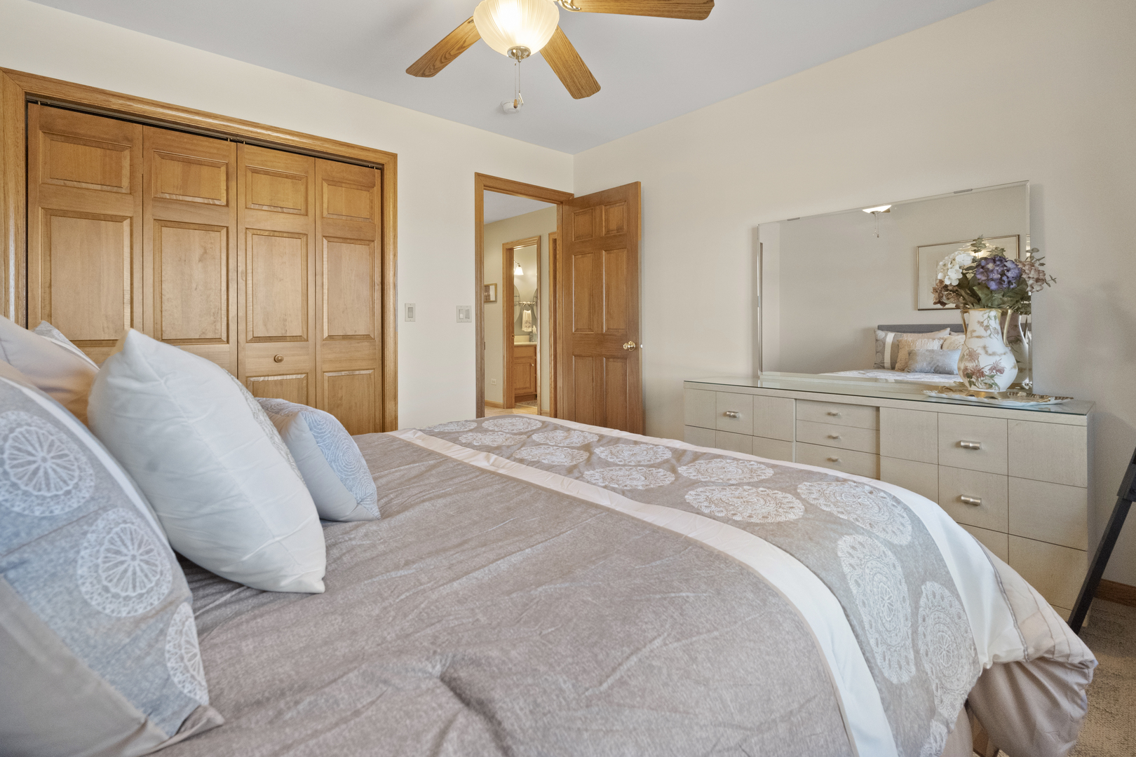 8202 Eagle Ridge Spring Grove, IL 60081 - Photo 33 of 44 a spacious bedroom with a bed and a dresser