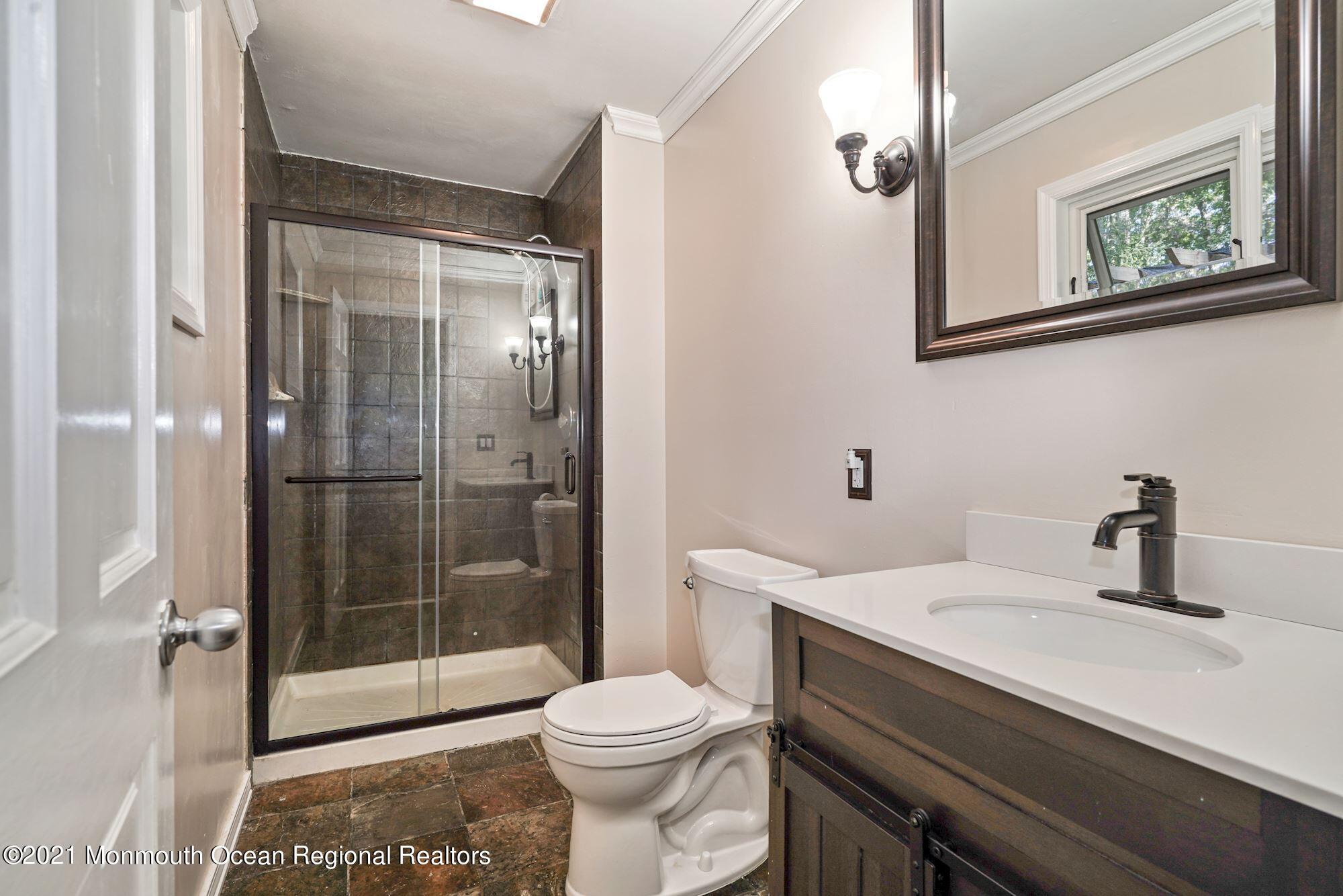 430 Freehold Road Jackson, NJ 08527 - Photo 22 of 36 a bathroom with a sink a toilet and shower