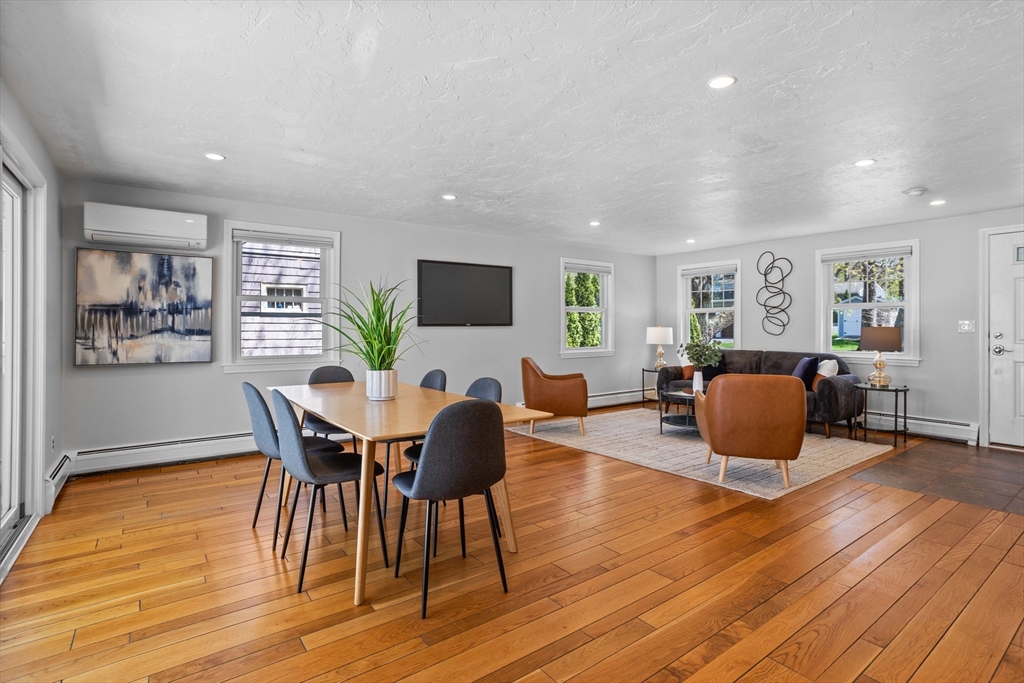 17 Hamblen Street Lexington, MA 02421 - Photo 12 of 42 a view of a dining room with furniture a rug and wooden floor