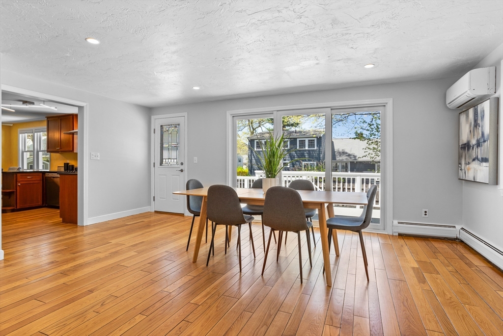 17 Hamblen Street Lexington, MA 02421 - Photo 16 of 42 a view of a dining room with furniture and wooden floor
