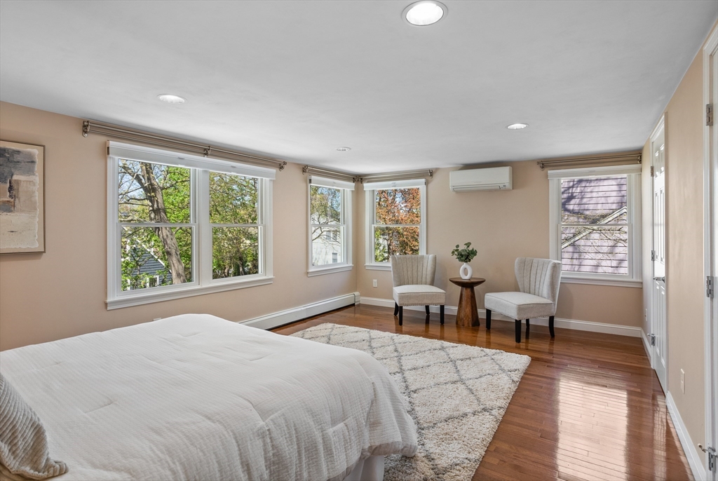 17 Hamblen Street Lexington, MA 02421 - Photo 22 of 42 a spacious bedroom with a bed and wooden floor