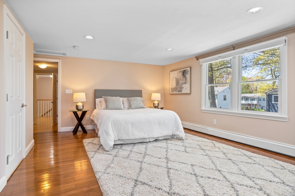 17 Hamblen Street Lexington, MA 02421 - Photo 23 of 42 a bedroom with a bed and a large window